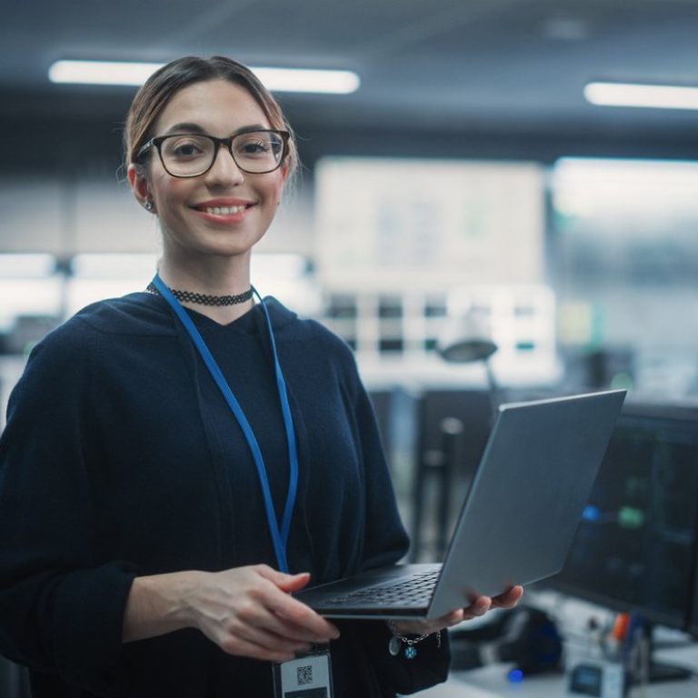 Portrait of an Attractive Empowered Multiethnic Woman Looking at Camera and Charmingly Smiling. Businesswoman at Work, Information Technology Manager, Software Engineering Professional
